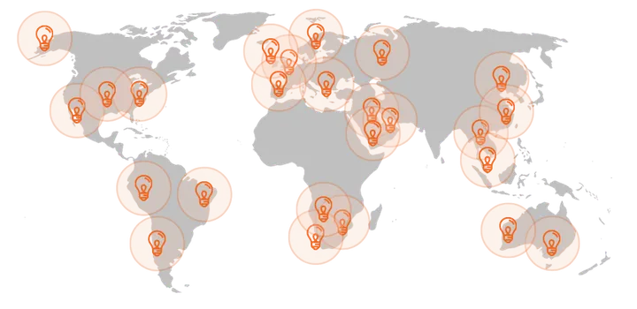 A world map with clusters of markers across North and South America, Europe, Africa, Asia and Australia, showing where Grad Coach clients study
